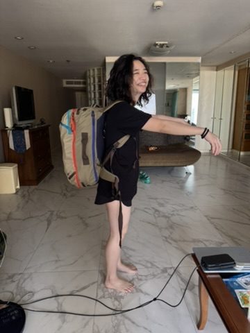 Peach with backpack in the condo