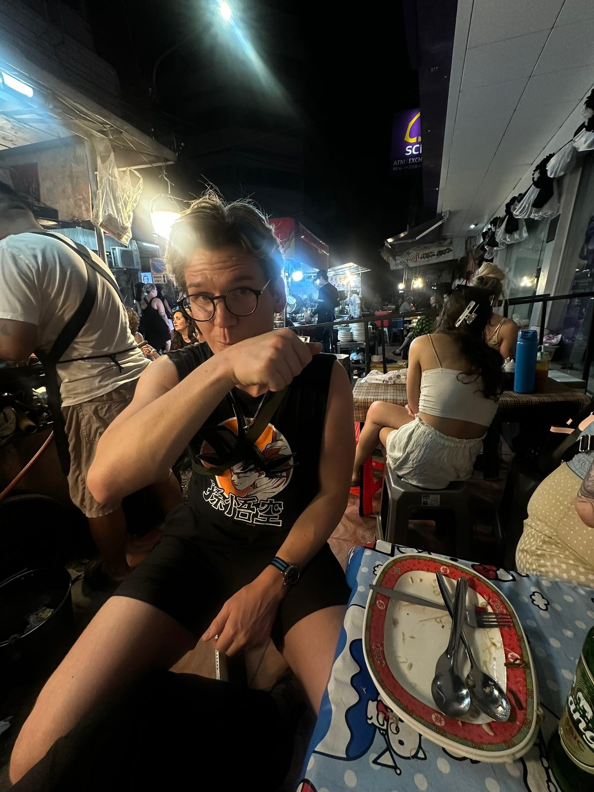 Ryker fist pose at street food stall