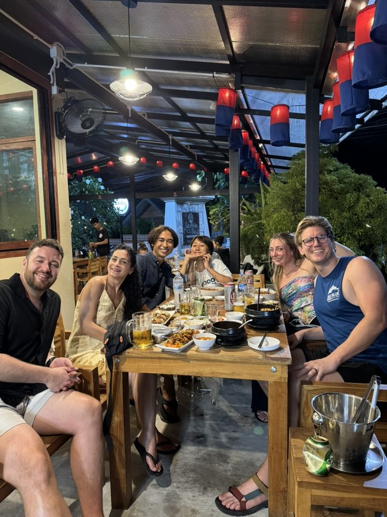 Group dinner with new friends under red lanterns