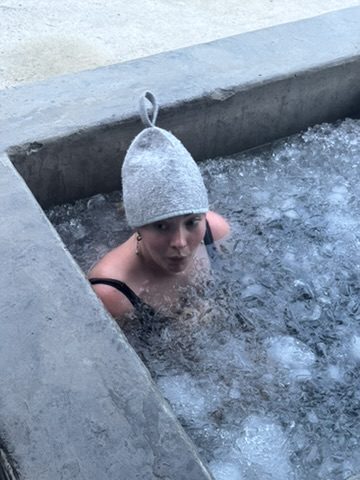 Meg in ice bath with sauna hat