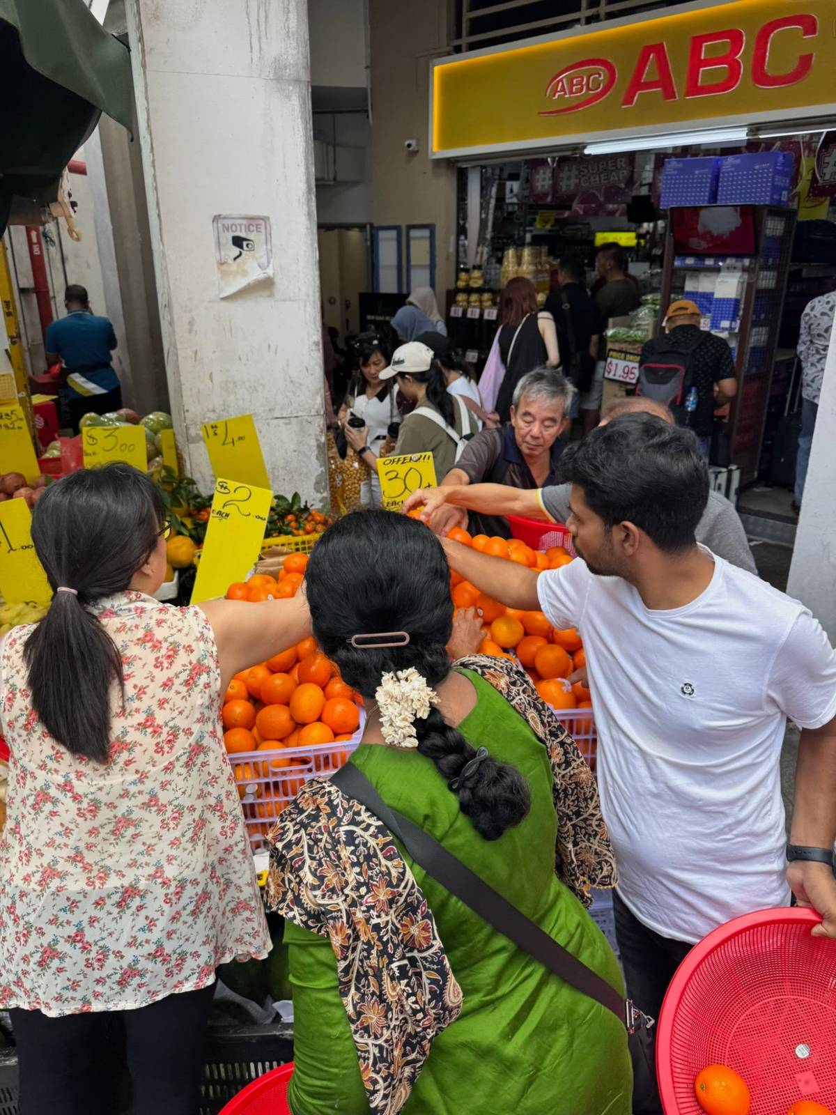 Busy Little India fruit stall with mandarins for Chinese New Year