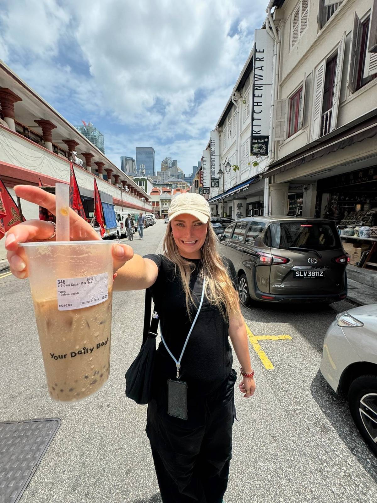 Meg holding up a boba in Chinatown