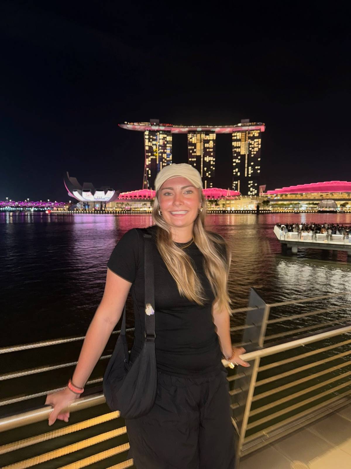 Meg standing at the railing in front of Marina Bay Sands