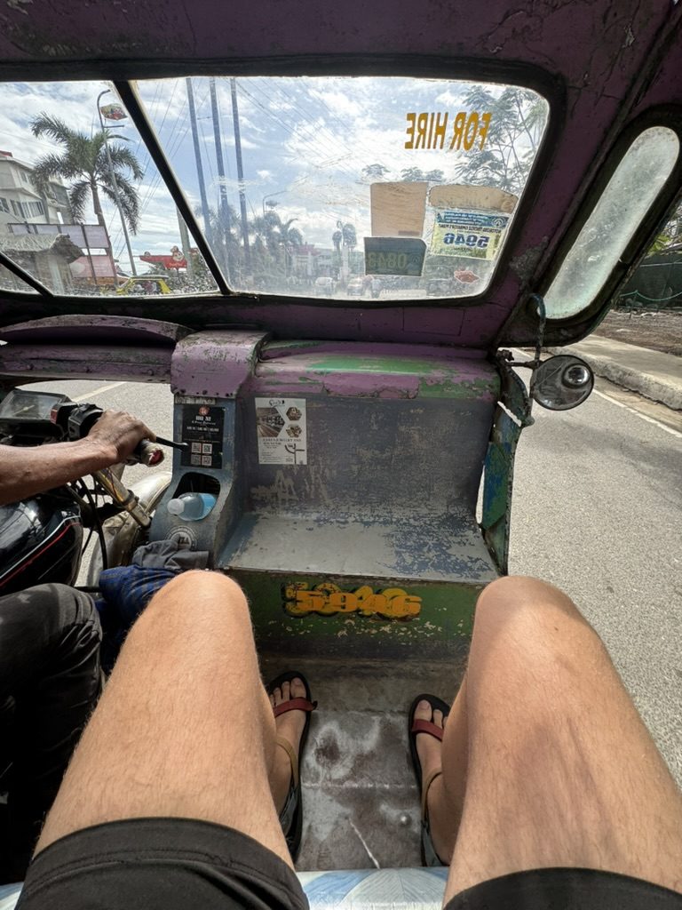 POV from inside a Filipino tricycle taxi in Puerto Princesa