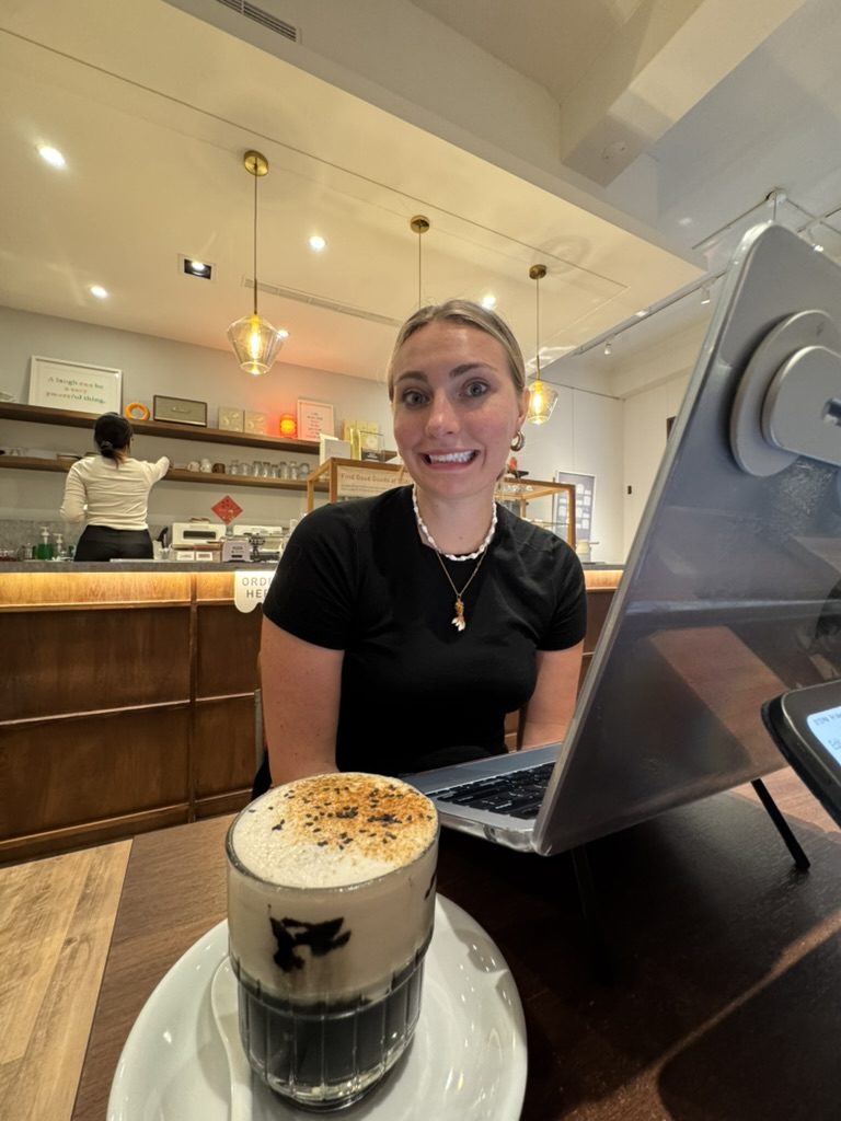 Meg at the coffee shop with sesame latte