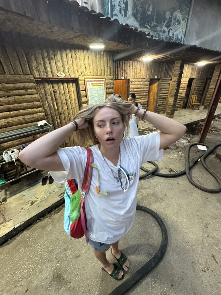 Meg entering the herbal bath house