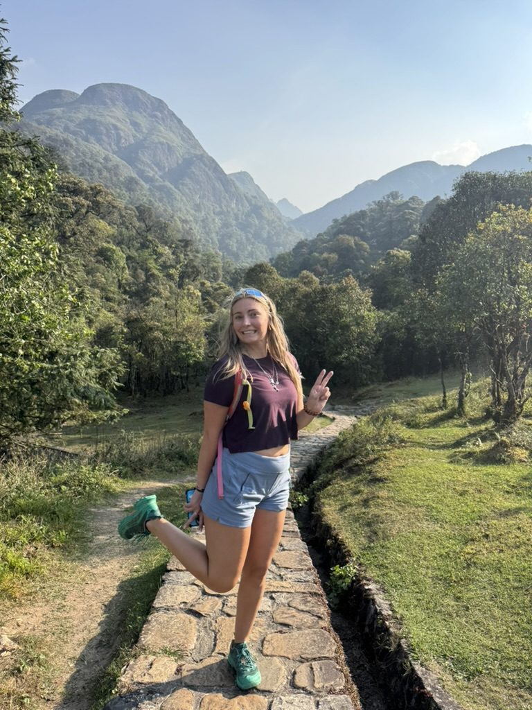 Meg posing with Sapa mountains behind her