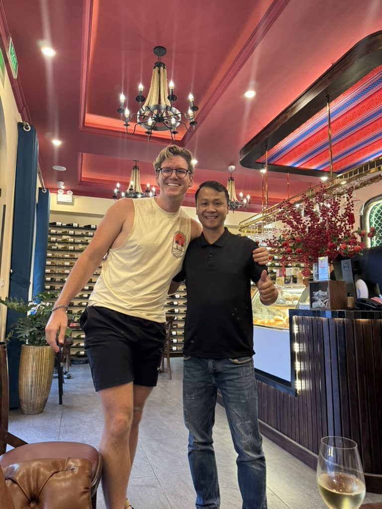 Ryker with a Hanoi restaurant owner