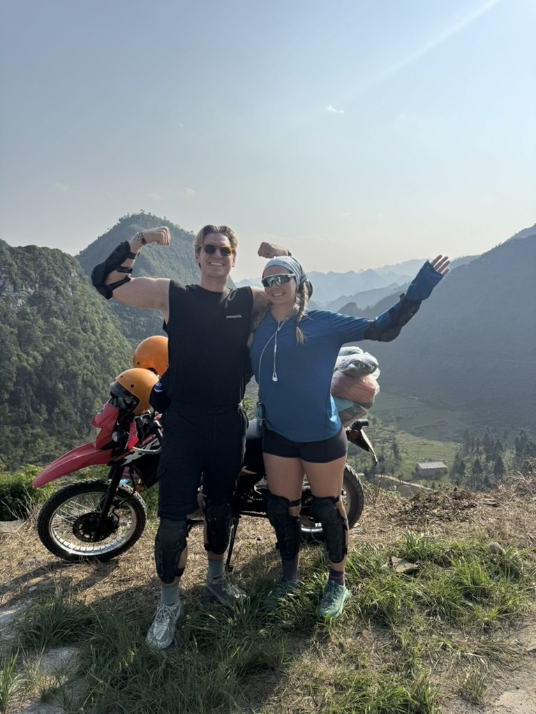 Ryker and Meg flexing in front of the dirtbike