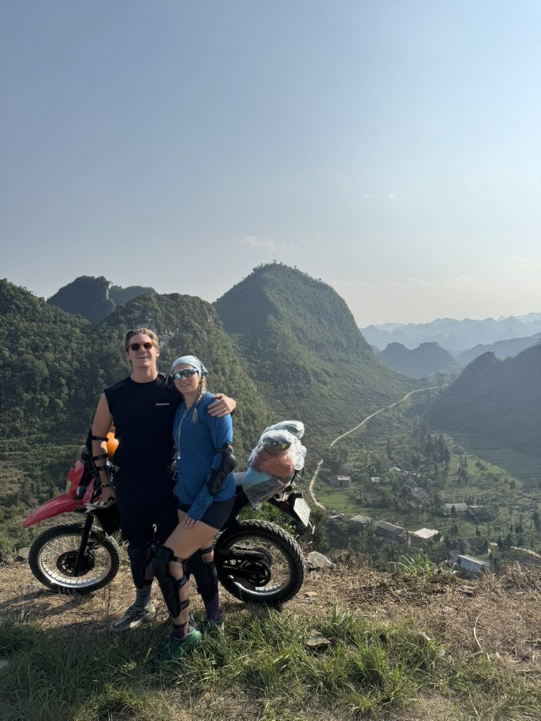 Ryker and Meg with the dirtbike overlooking Ha Giang mountains