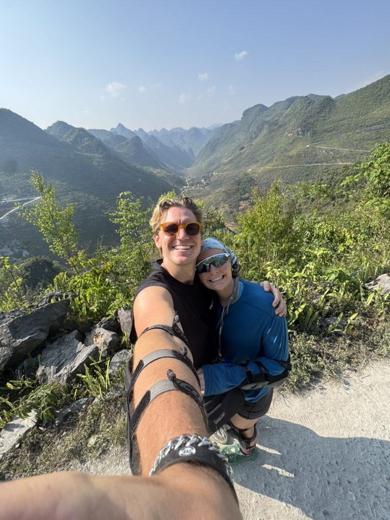 Ryker and Meg selfie on a cliff edge on the Ha Giang Loop