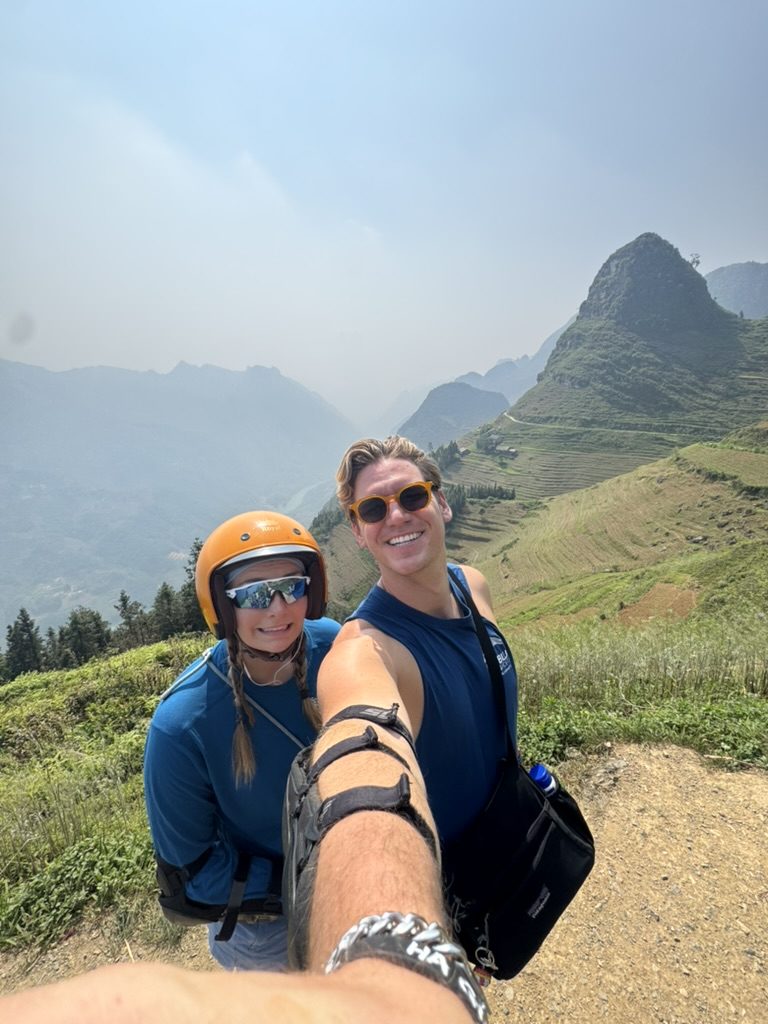 Ryker and Meg selfie with rice terraces behind