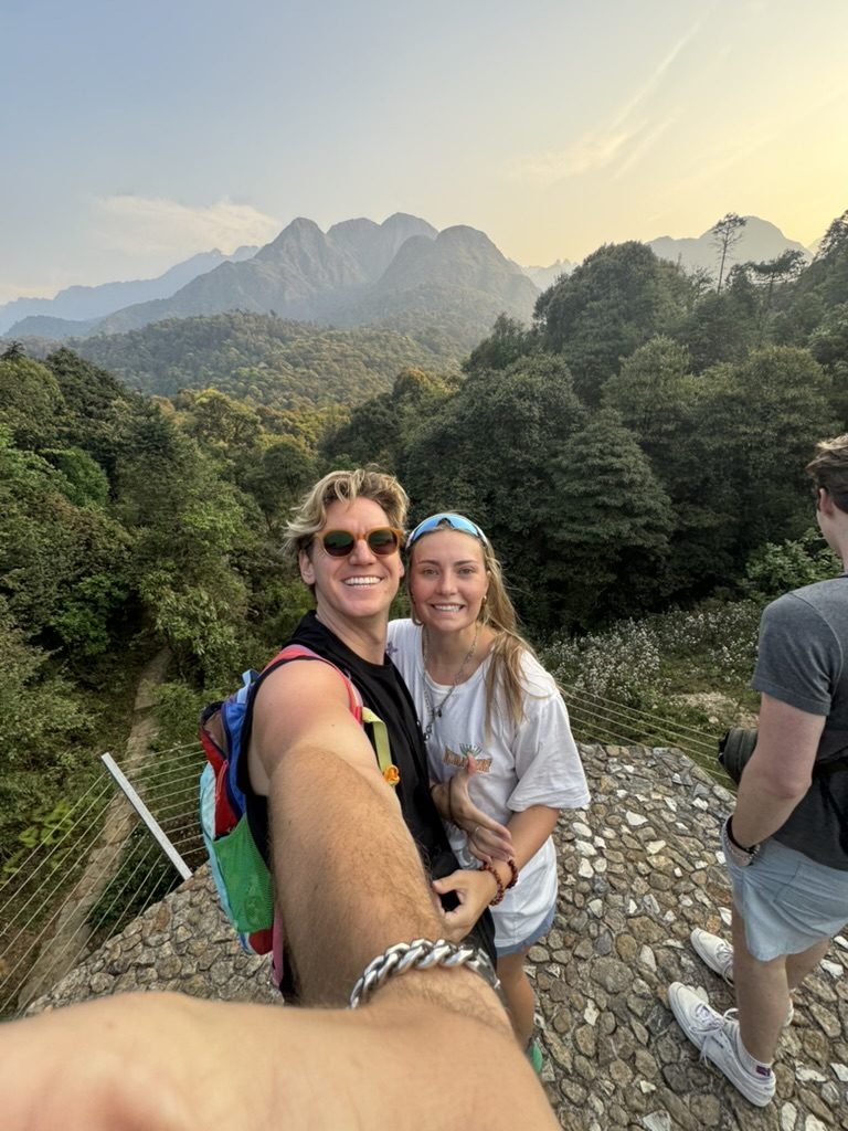 Ryker and Meg selfie at sunset over the Sapa mountains