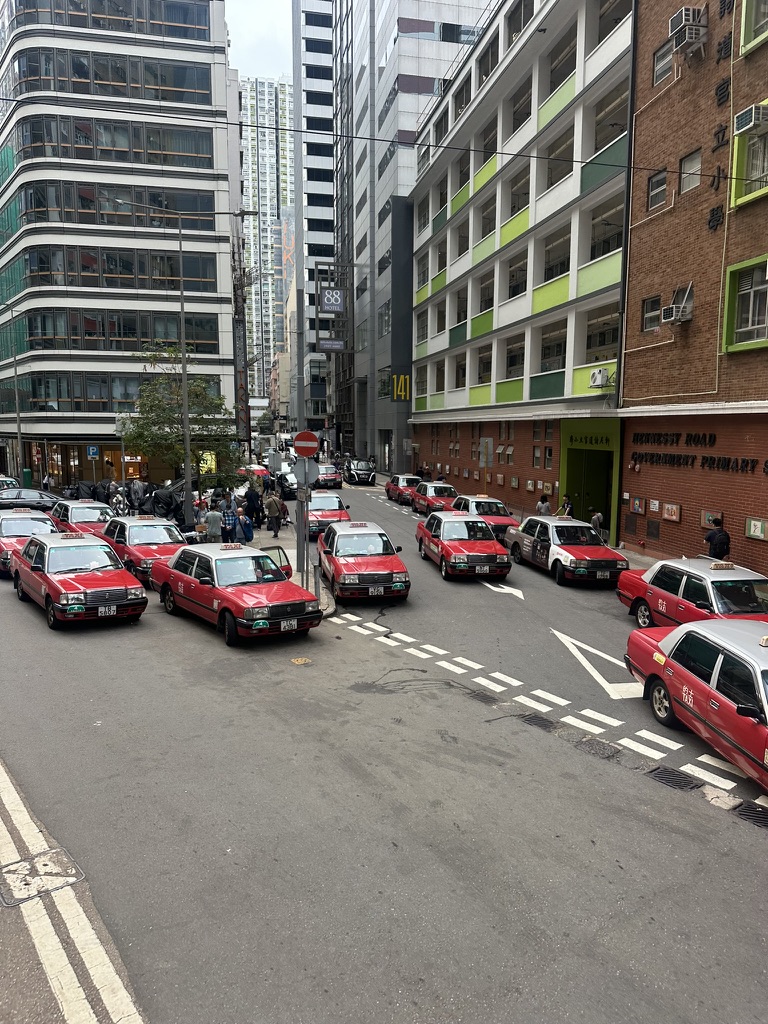 A fleet of red taxis