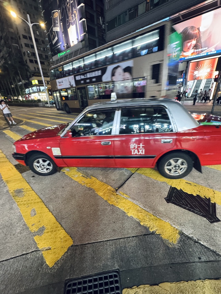 Hong Kong red taxi at night