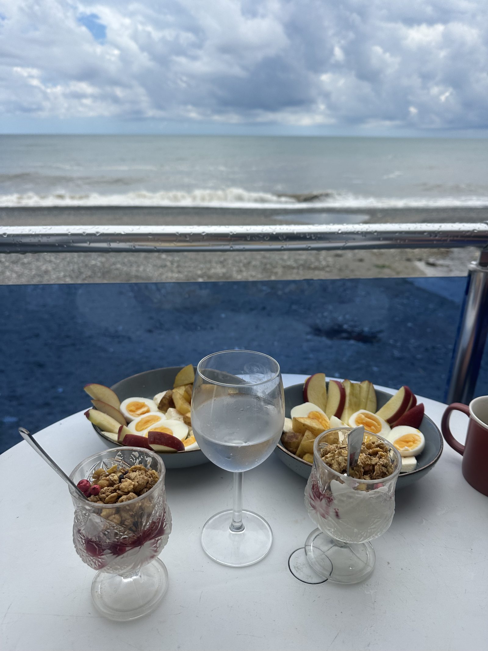 A yogurt-and-fruit breakfast overlooking the sea