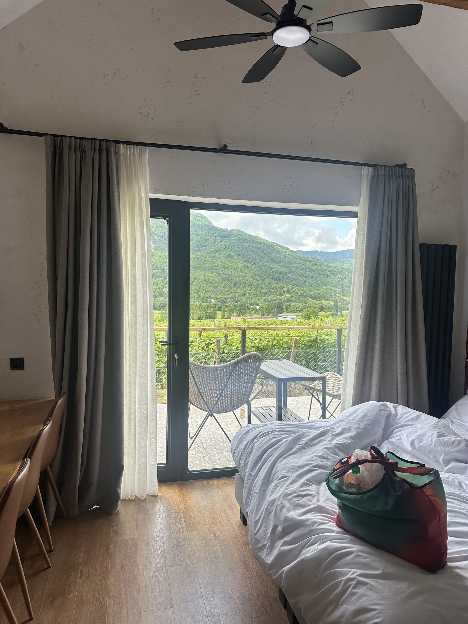 A bright cabin bedroom opening onto the fields
