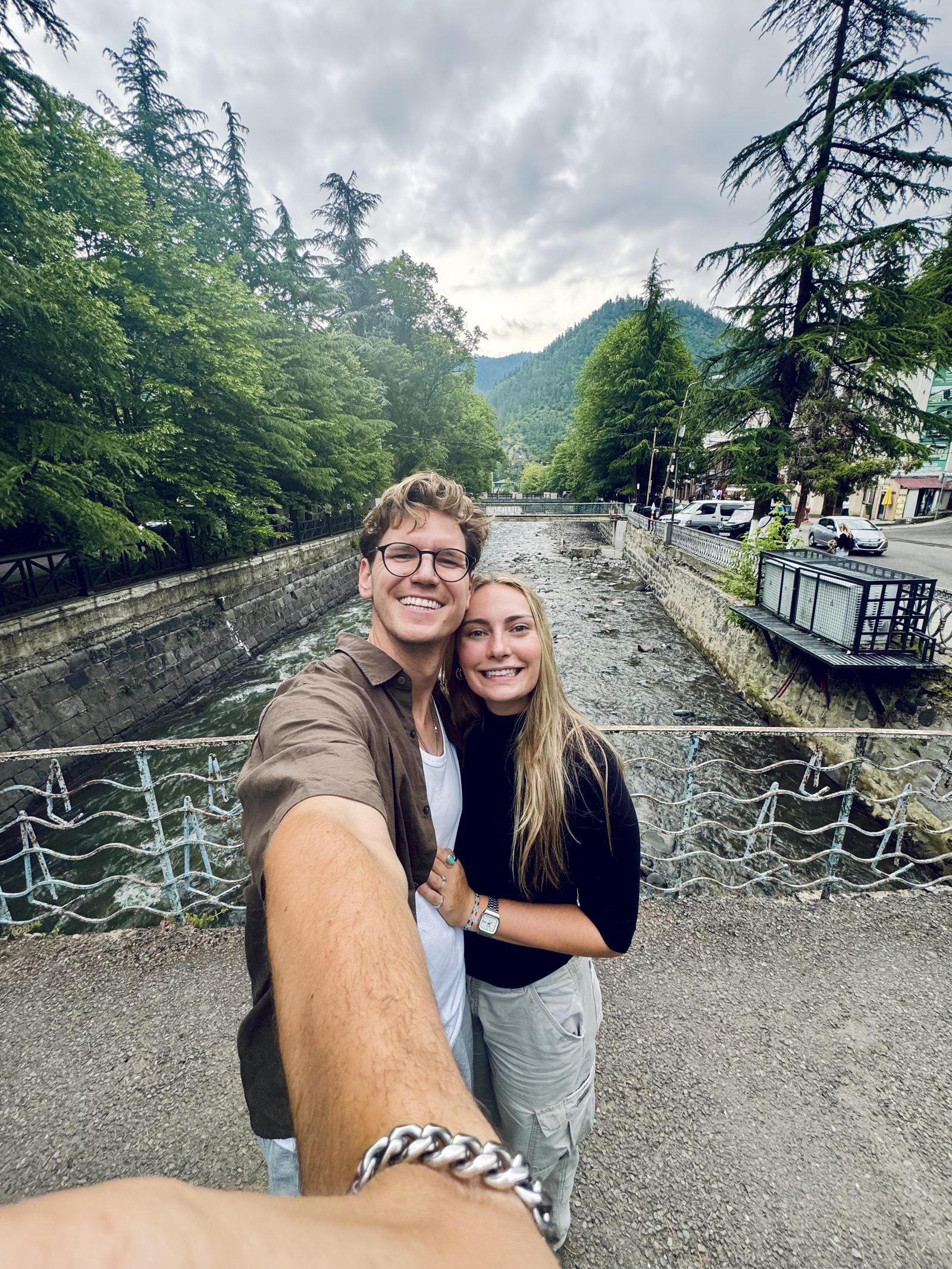 A couple selfie in a riverside Georgian town