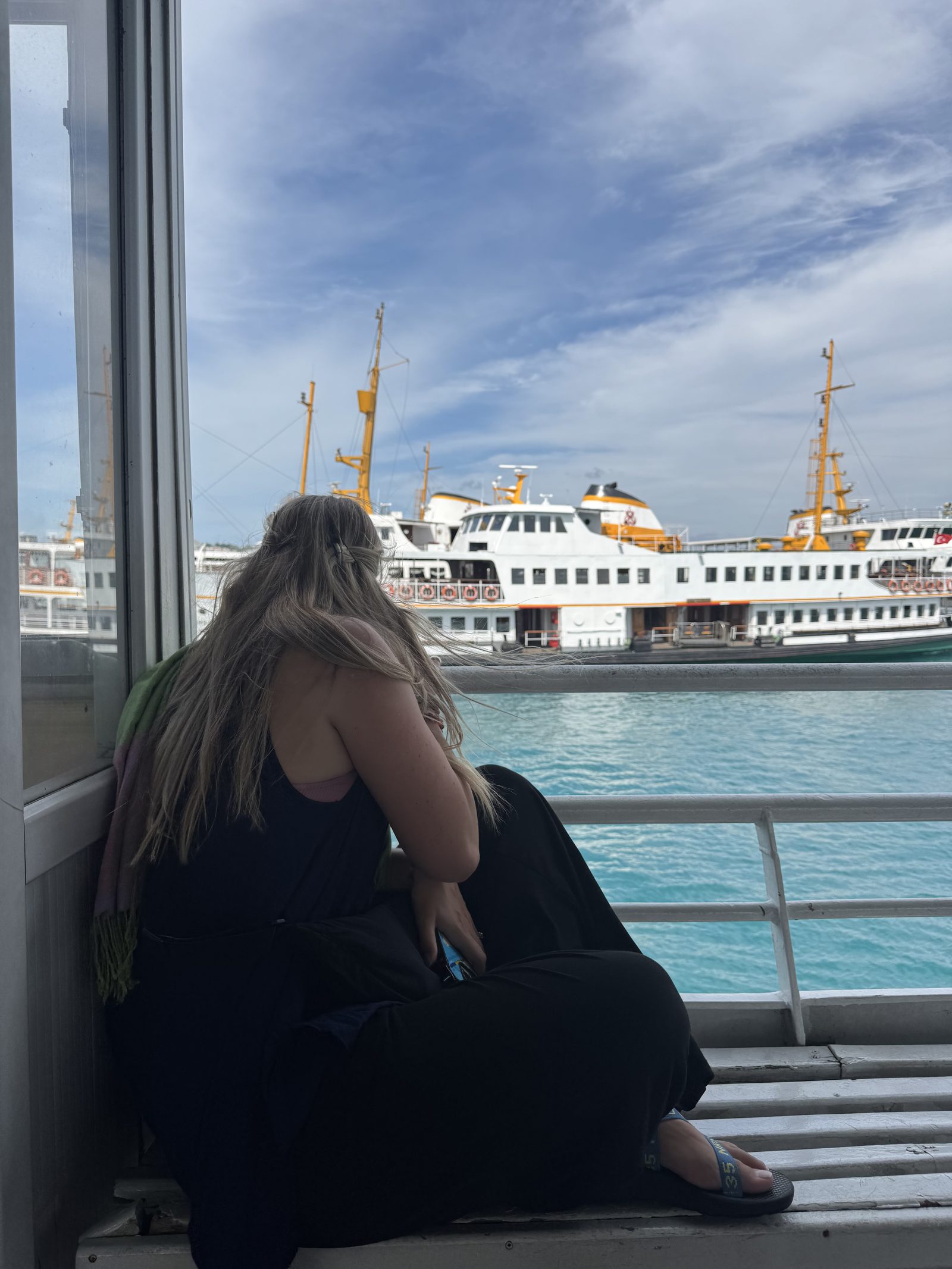 A ferry crossing the water seen through the window