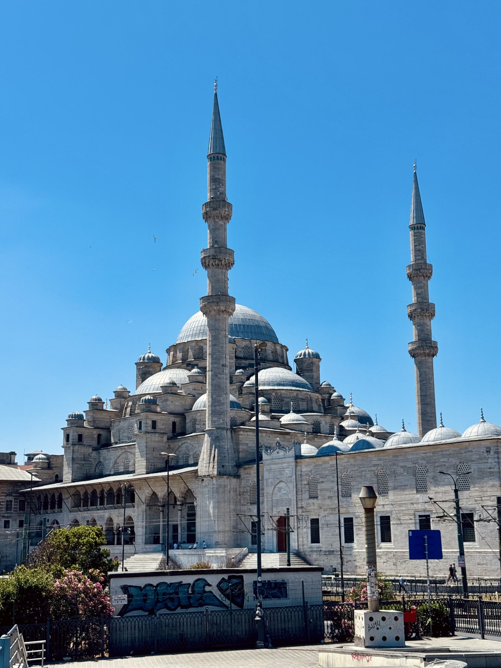 An Istanbul mosque with its minarets against a blue sky