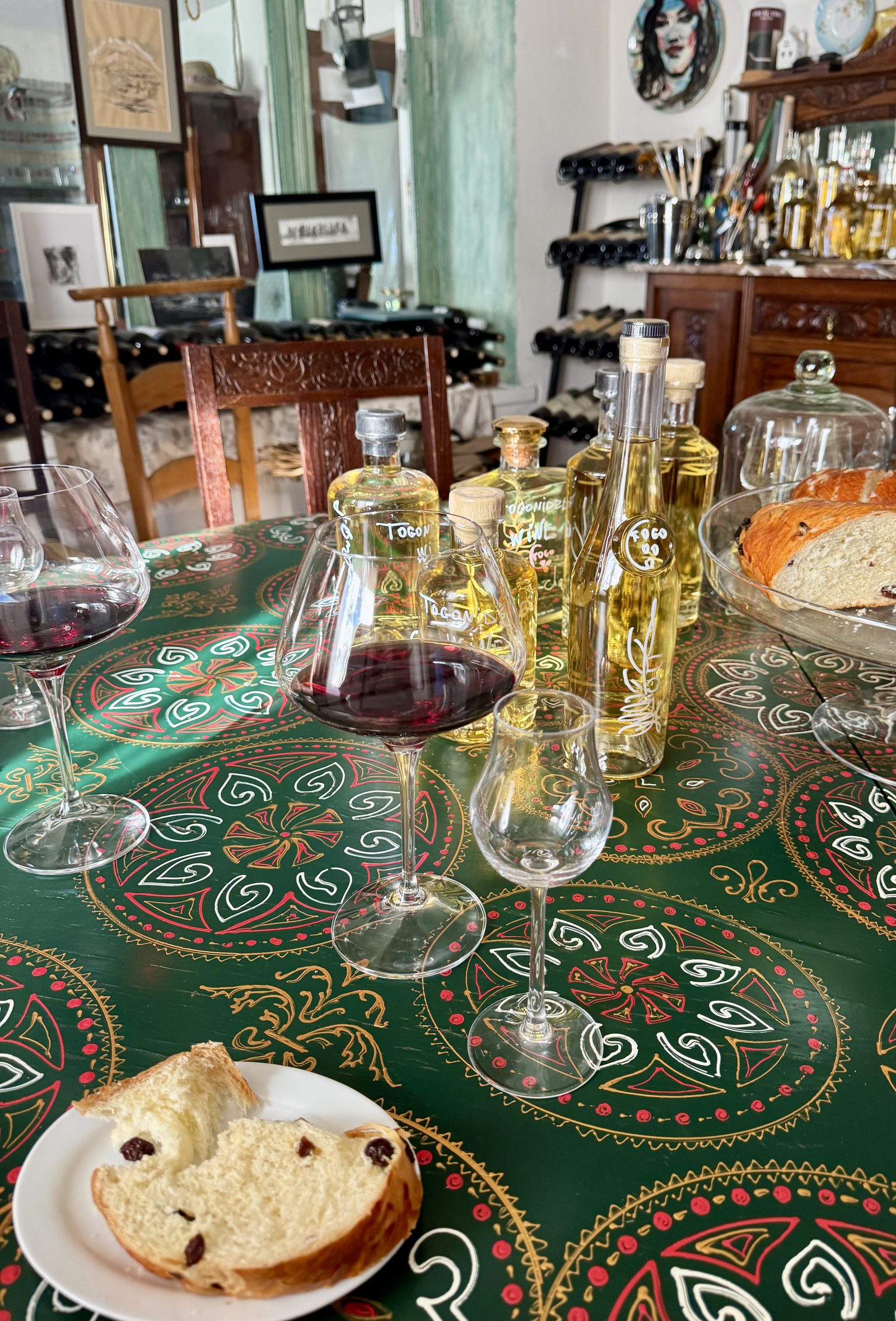 Chacha bottles and glasses on a painted table
