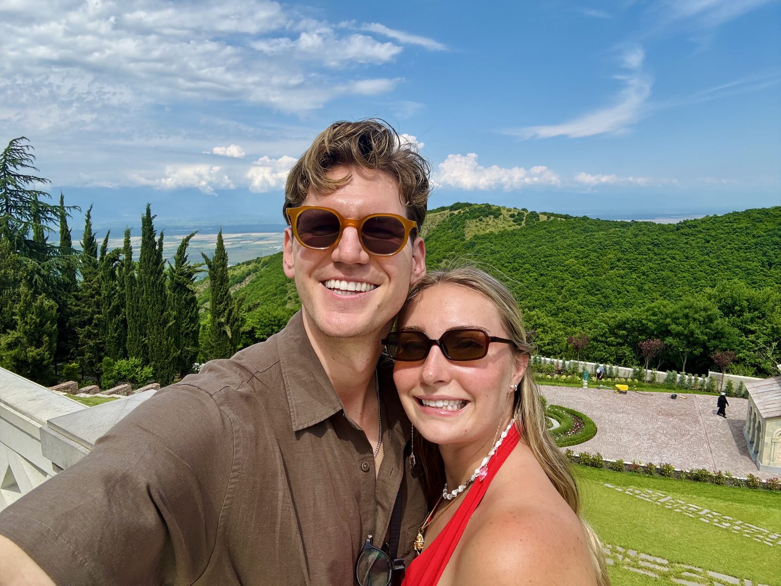 A couple selfie with green Kakheti hills behind