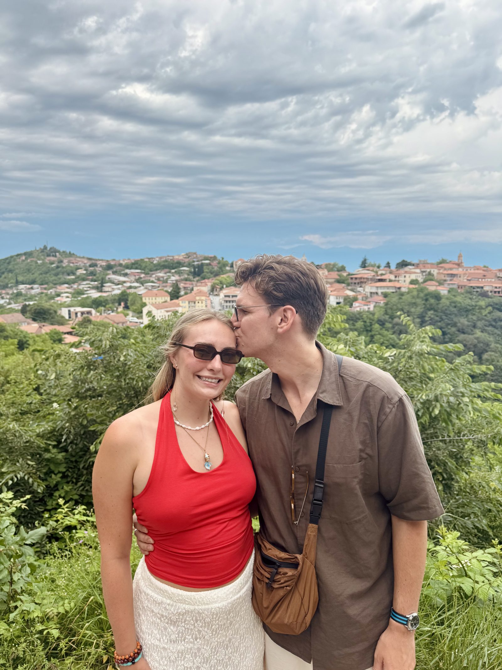A couple with the Kakheti valley stretching behind