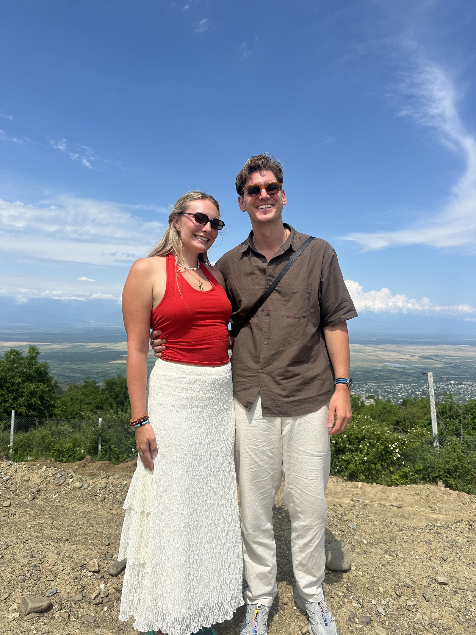 A couple with the Kakheti valley behind them