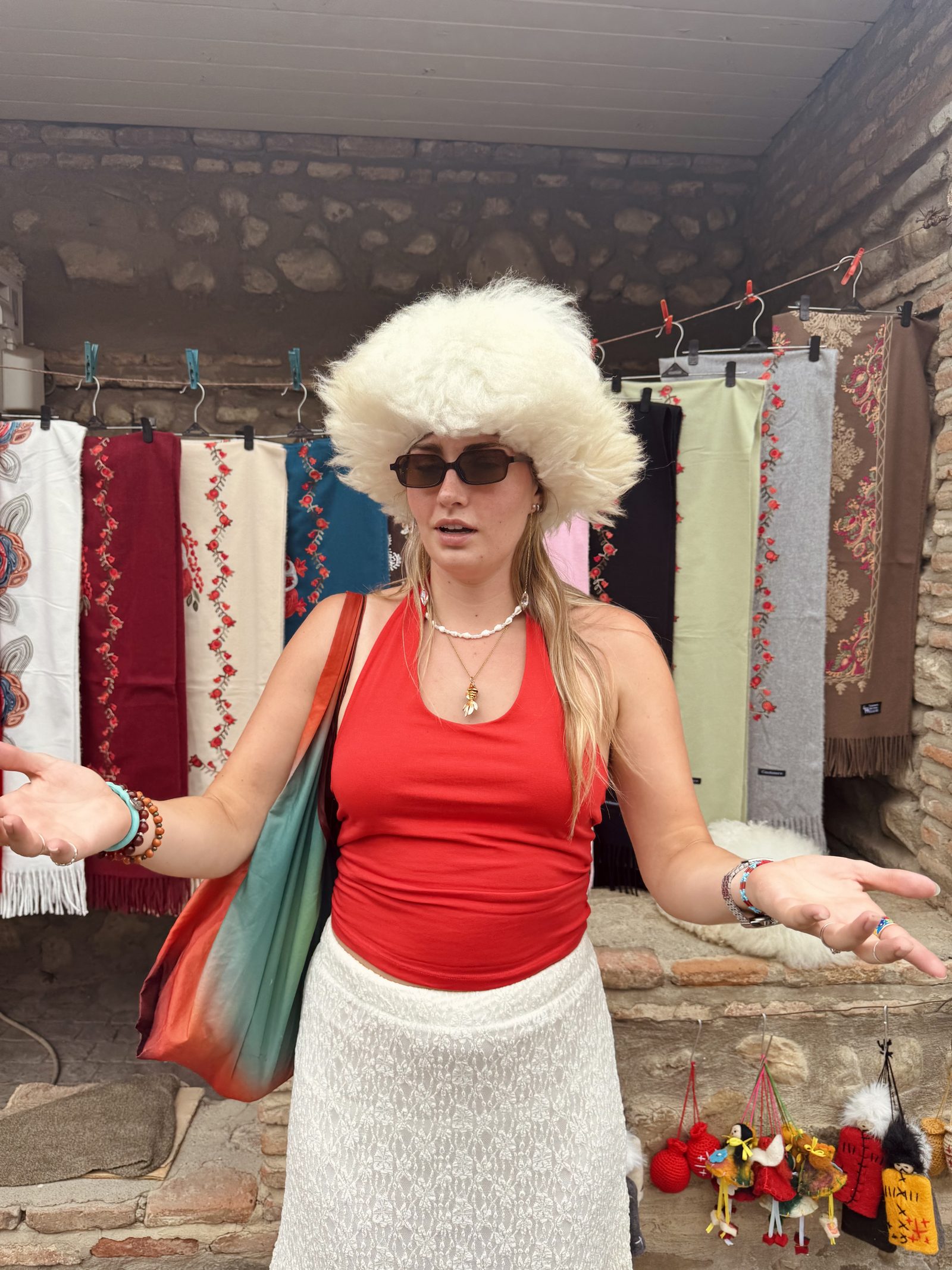 Trying on a traditional Georgian fur hat at a stall