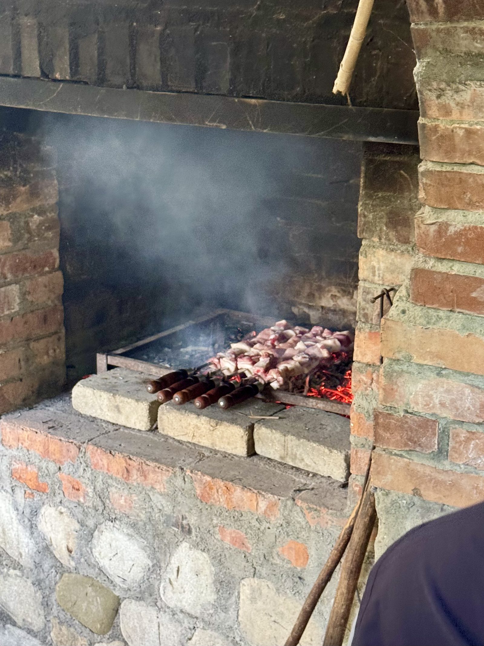 Georgian mtsvadi grilling over coals
