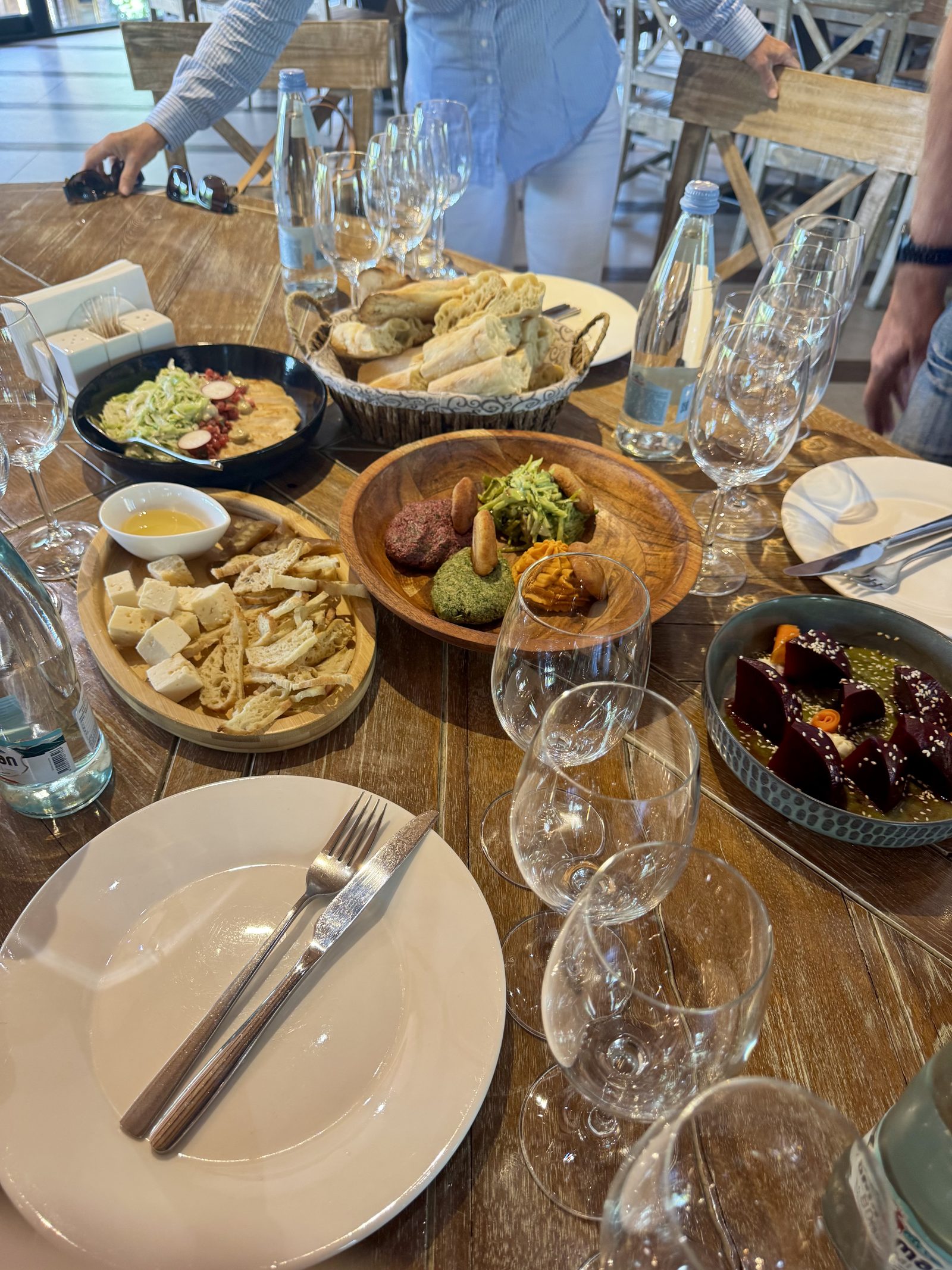 A spread of Georgian dishes and wine on the table