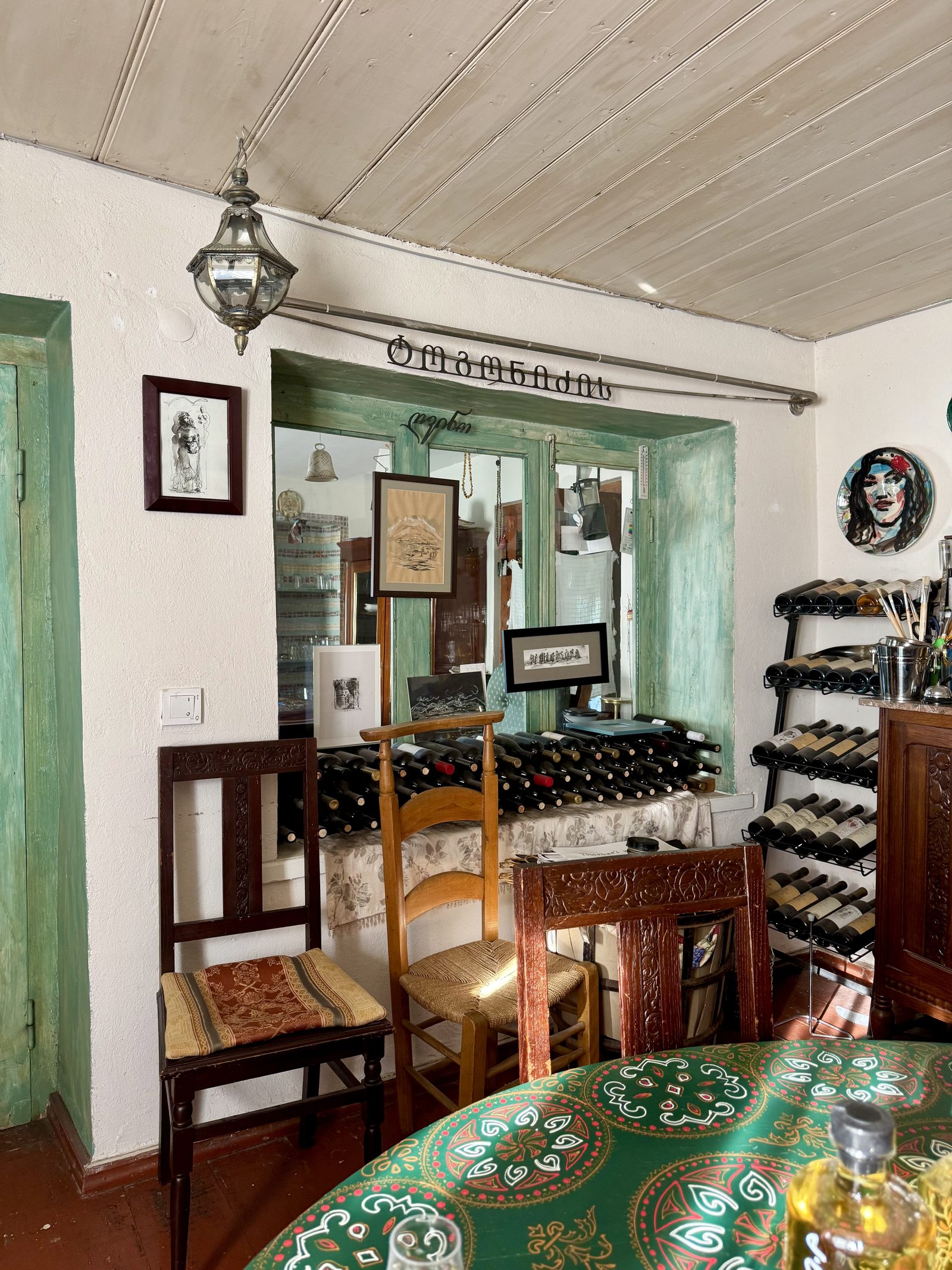 A cozy winery tasting room with wine racks
