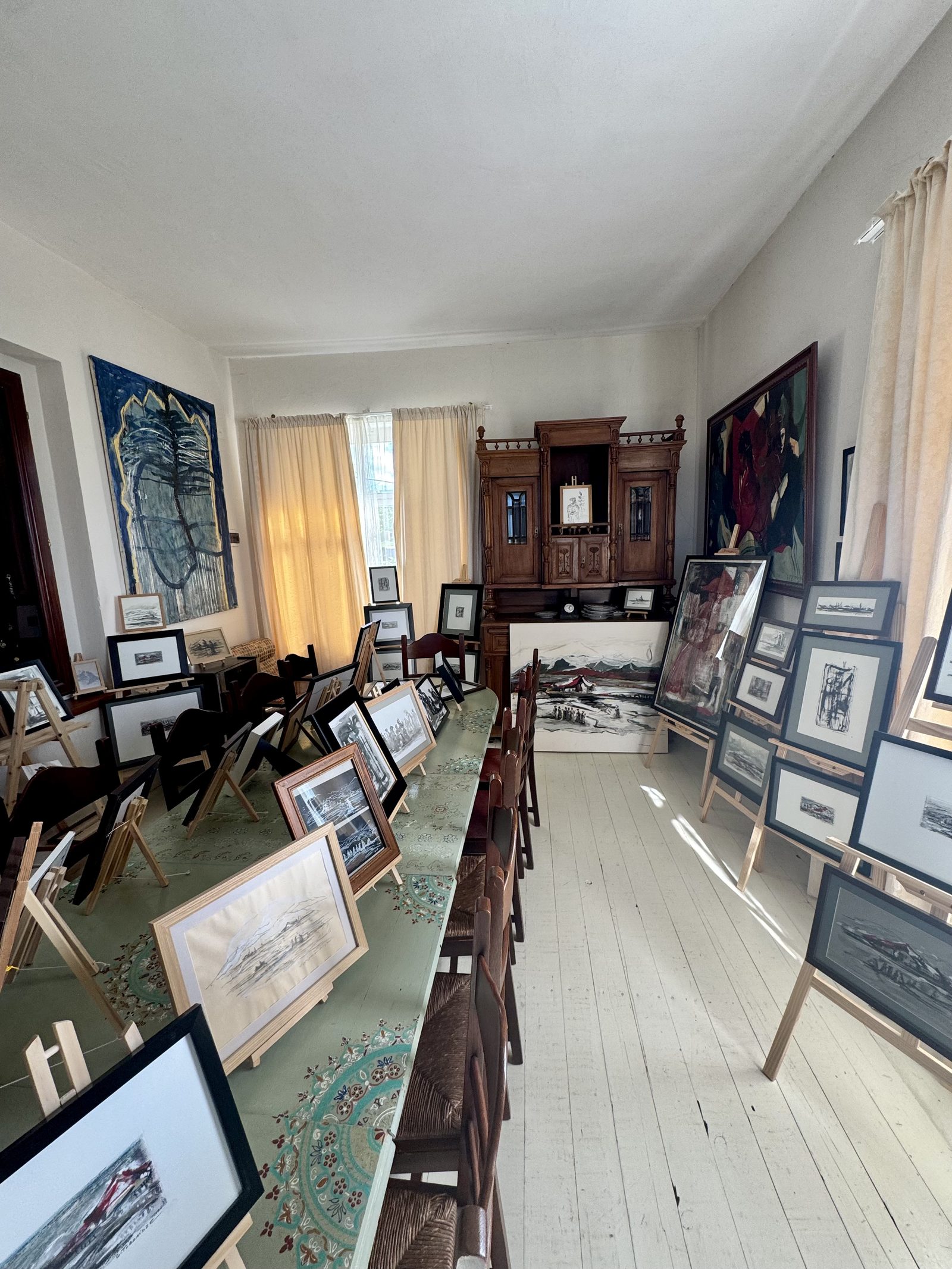A winery room hung with framed art
