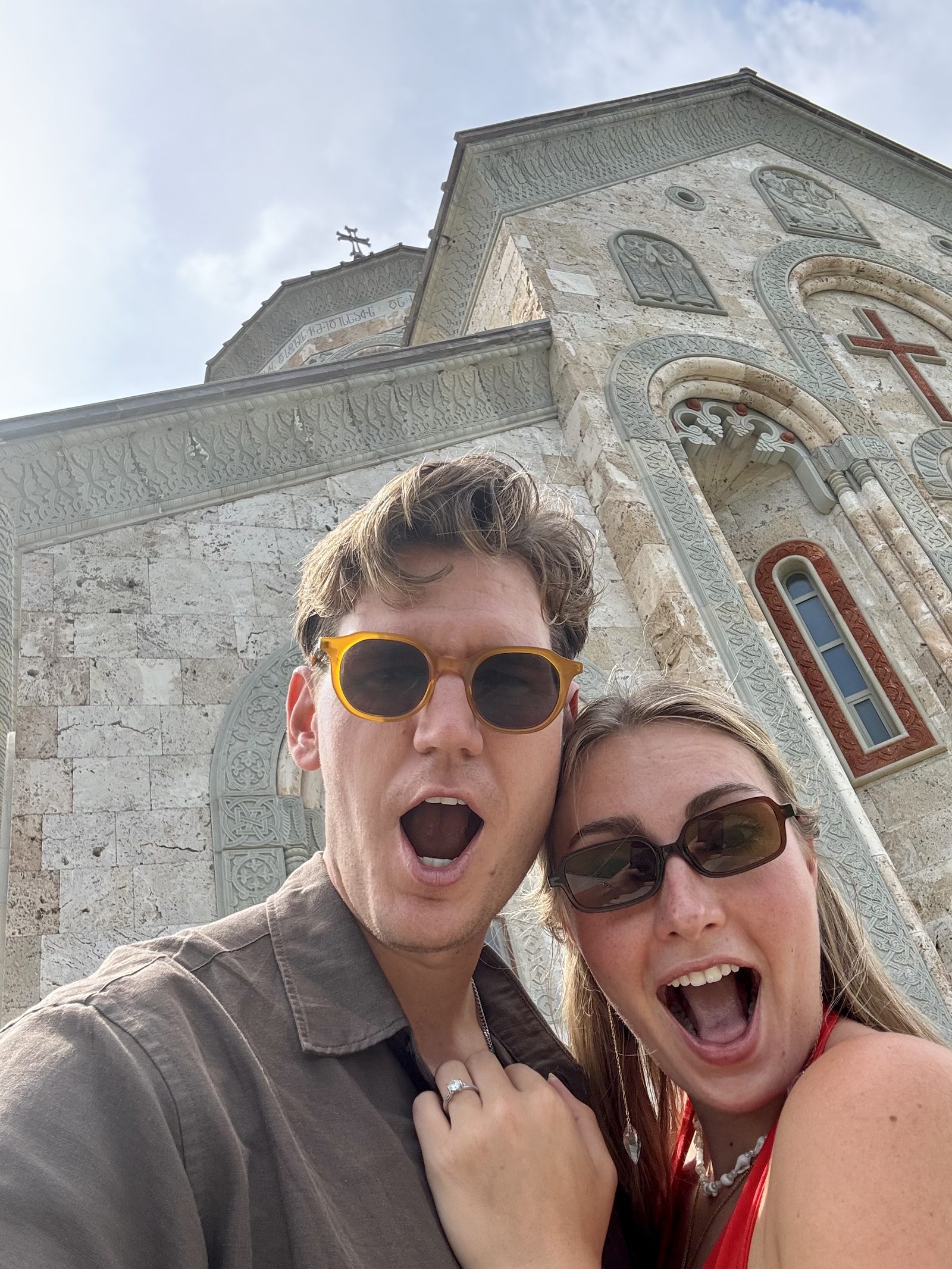 A couple in front of a Sighnaghi church