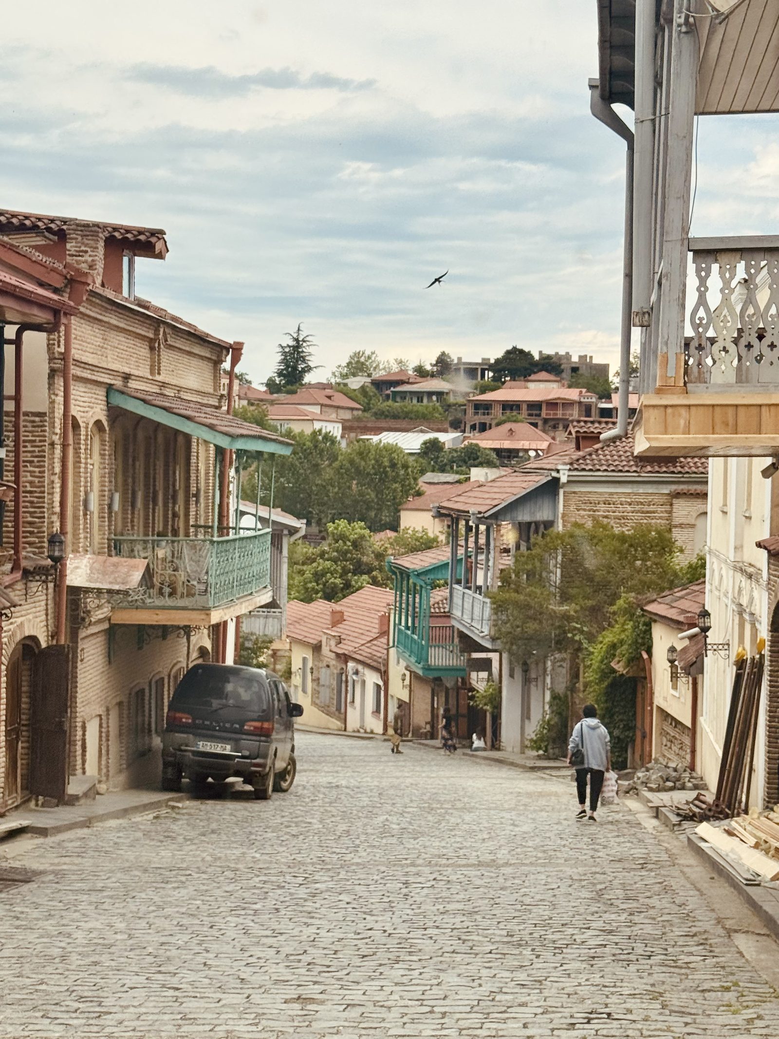A cobbled Sighnaghi street lined with balconied houses