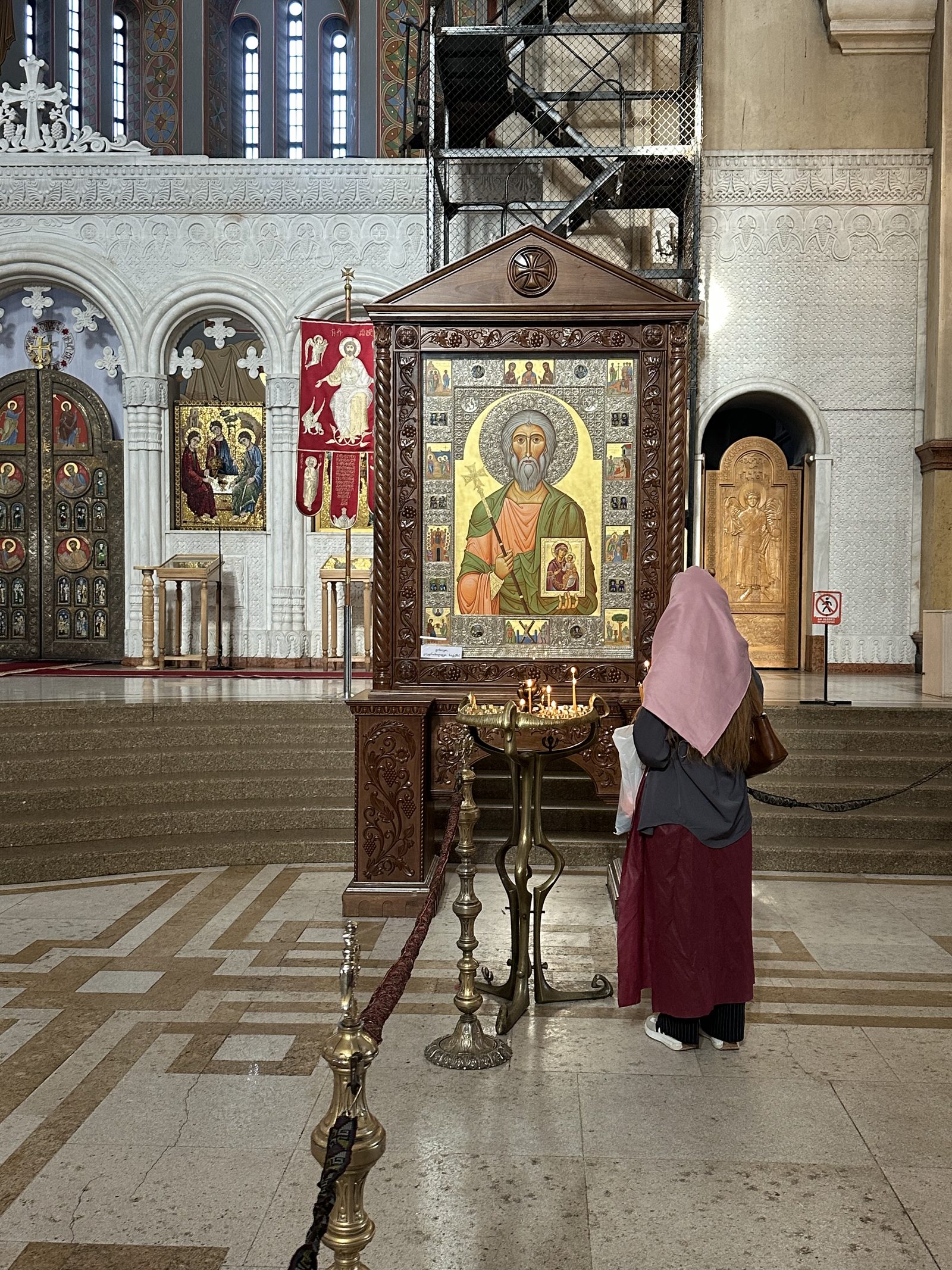 An icon and candles inside the cathedral