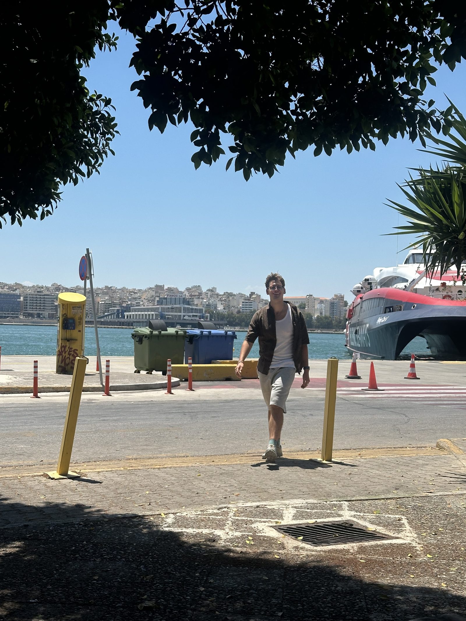 Ryker walking along the dock with a ferry in the background