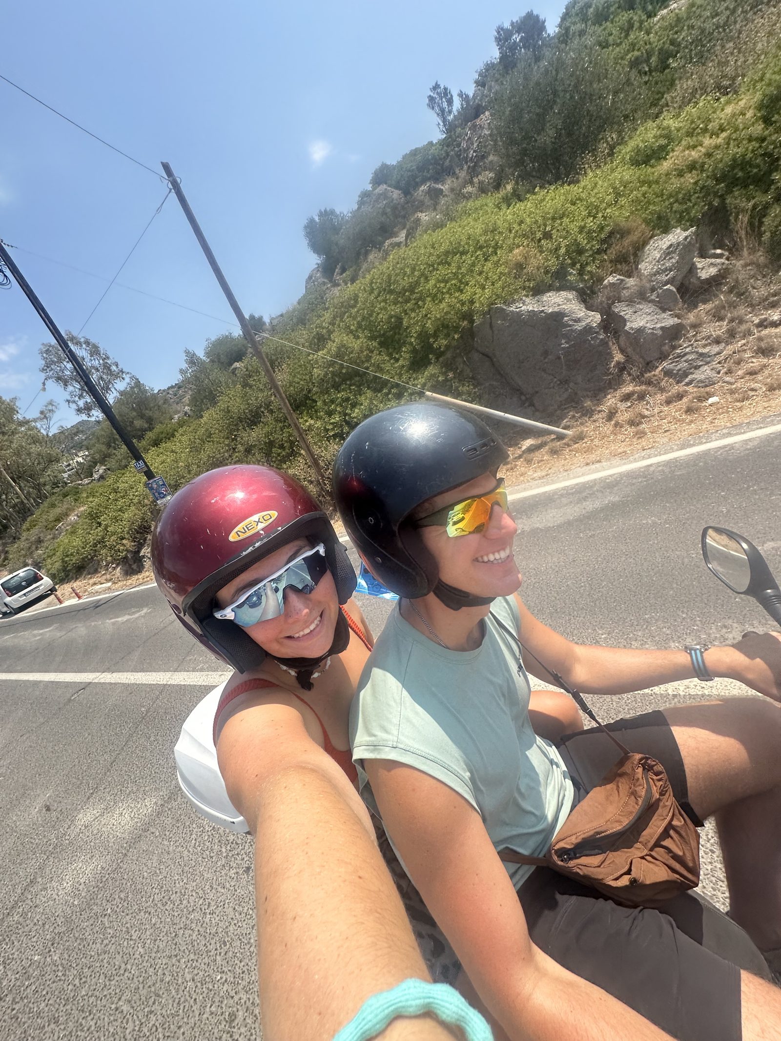 Meg and Ryker riding a scooter