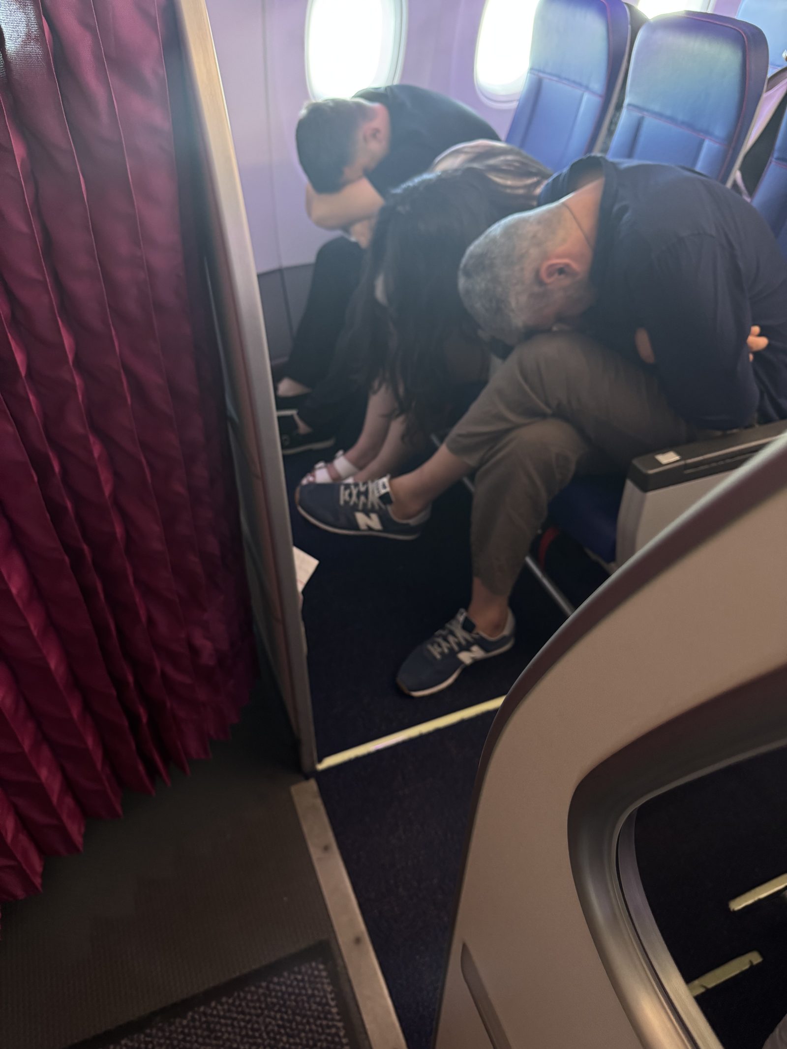 Ryker and Meg passed out asleep on the plane