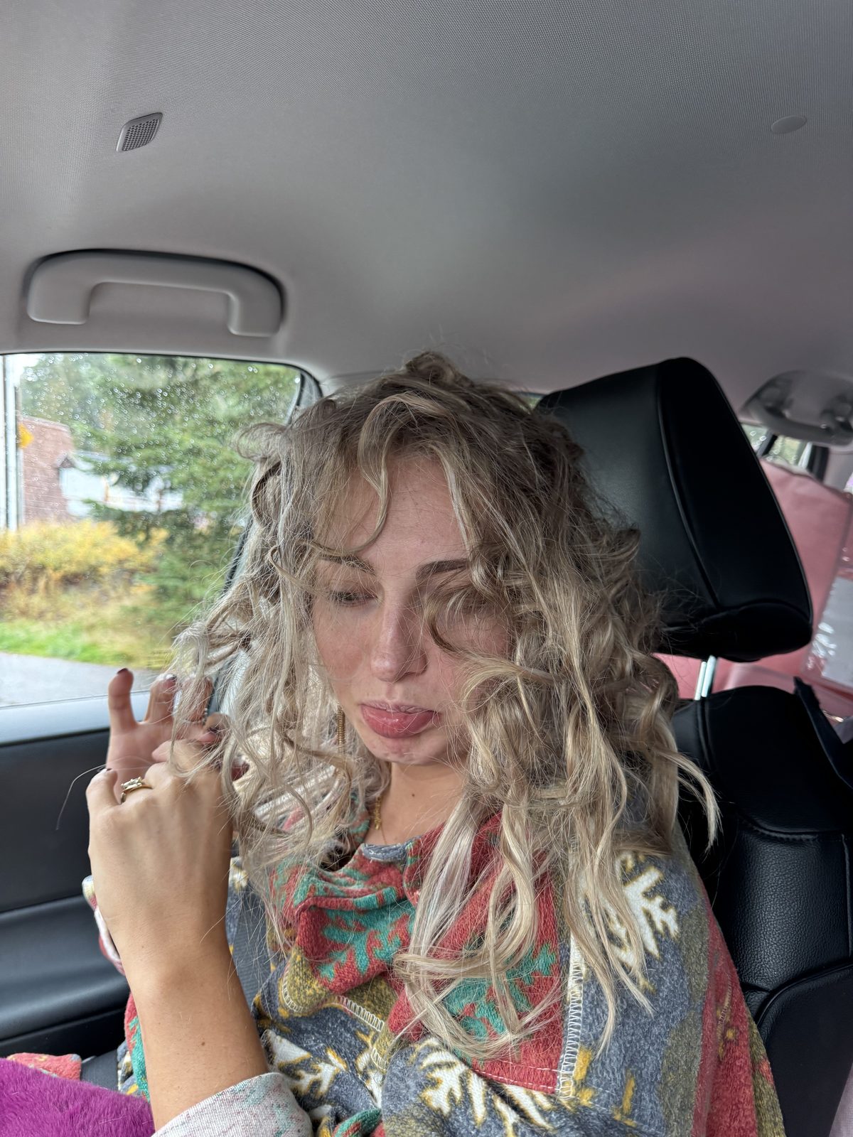 Meg peace sign in car