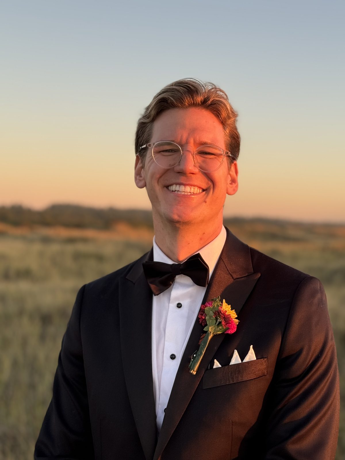 Ryker in tuxedo at sunset